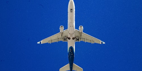 Airplane on blue background