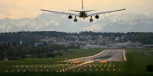 A plane comes into land on a runway