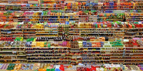 Busy, multicolored supermarket shelves seen from high up