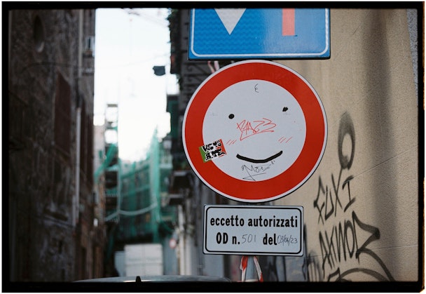 Smiley face on a road sign