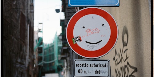 Smiley face on a road sign