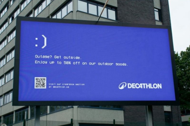 Billboard from Decathlon with a blue screen mimicking the error sign of Microsoft