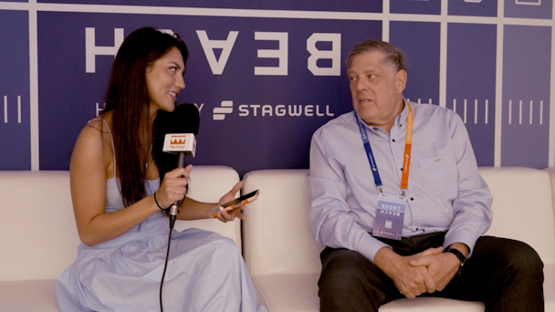 The Drum's Kendra Barnett sits on a couch interviewing Stagwell CEO Mark Penn