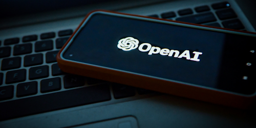 OpenAI logo on mobile screen