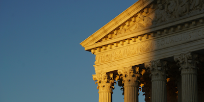 Corner image of the United States Supreme Court building facade